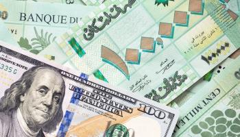 Lebanese pounds and a US dollar note (Shutterstock)