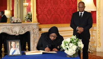 Tanzanian President Samia Suluhu Hassan signs condolence book for former British Queen Elizabeth II (Jonathan Hordle/WPA Pool/Shutterstock)