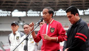 President Joko 'Jokowi' Widodo (second from right) alongside State-Owned Enterprises Minister and Football Association of Indonesia Chairman Erick Thohir (right) (Bagus Indahono/EPA-EFE/Shutterstock)