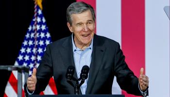 North Carolina Governor Roy Cooper, whose retirement next year because of term limits sets up a competitive governor's race next year, speaks in Charlotte, NC June 24 (Shutterstock)