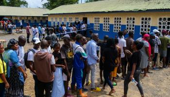 People wait outside Freetown polling station in Sierra Leone's June 24 election (Ibrahim Barrie/EPA-EFE/Shutterstock)