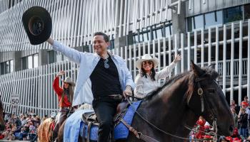 Conservative Party leader Pierre Poilievre rides in the Calgary Stampede parade with his wife Anaida, Calgary, July 7, 2023 (Canadian Press/Shutterstock)