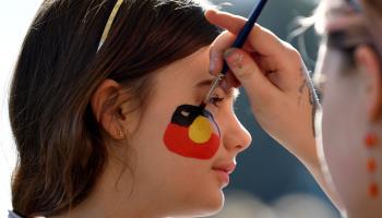 A girl has the Aboriginal flag painted on her face during a event in support a ‘yes’ vote in the referendum, July 2, 2023 (BIANCA DE MARCHI/EPA-EFE/Shutterstock)
