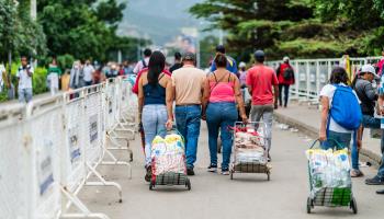 People cross the Simon Bolivar International Bridge that links Colombia and Venezuela (Shutterstock)