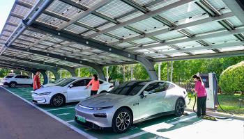 Charging an electric vehicle (Costfoto/NurPhoto/Shutterstock)