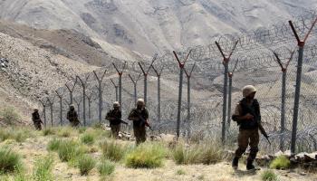 Pakistani troops patrolling along the Pakistan-Afghanistan border fence in Khyber Pakhtunkhwa province (Sohail Shahzad/EPA-EFE/Shutterstock)