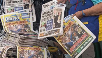 A street vendor sells newspapers telling of Arevalo's election win. Guatemala City, August 21 (Esteban Biba/EPA-EFE/Shutterstock)