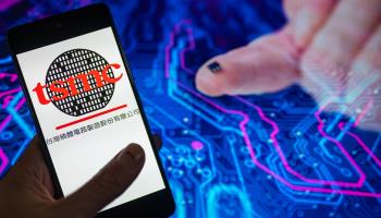 TSMC logo and microchip (Jonathan Raa/NurPhoto/Shutterstock)