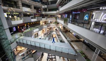 Little occupied shopping mall in China (Alex Plavevski/EPA-EFE/Shutterstock)
