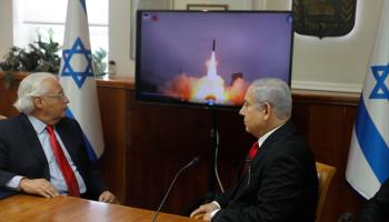 Israeli Prime Minister Binyamin Netanyahu and the then-US ambassador watch a video showing the launch of the Arrow 3 hypersonic anti-ballistic missile during a cabinet meeting in Jerusalem, July 28, 2019 (AFP Pool/Menahem Kahana/POOL/EPA-EFE/Shutterstock)