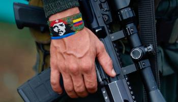 A FARC dissident guerrilla holds his rifle, in Casa Roja, Colombia, April 2023 (Ernesto Guzmán/EPA-EFE/Shutterstock)