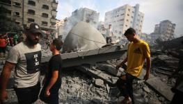 Palestinians inspect the damage following an Israeli airstrike on the Sousi mosque in Gaza City on October 9, 2023 (Majdi Fathi/NurPhoto/Shutterstock)