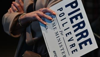 A supporter of Pierre Poilievre holds a poster during last year's Conservative leadership election in Edmonton. (Artur Widak/NurPhoto/Shutterstock)