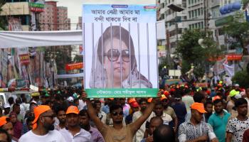 A supporter holding a placard of Bangladesh Nationalist Party leader Khaleda Zia during a rally outside the party's headquarters in Dhaka in July (Syed Mahabubul Kader/ZUMA Press Wire/Shutterstock)