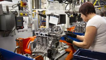Worker assembles a car engine at an Opel factory in Hungary (Gyorgy Varga/EPA-EFE/Shutterstock)