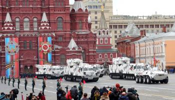 Russian forces in arctic camouflage armoured vehicles (Kremlin Pool/Planet Pix Via Zuma Wire/Shutterstock)