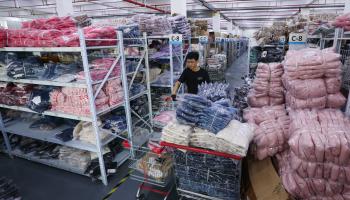 An employee picks up orders in a warehouse in Zhejiang province ahead of the ‘double eleven’ e-commerce festival (Xinhua/Shutterstock)