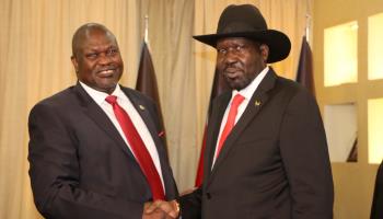 President Salva Kiir and opposition leader Riek Machar shake hands after agreeing to form a unity government, October 19, 2019 (STR/EPA-EFE/Shutterstock)