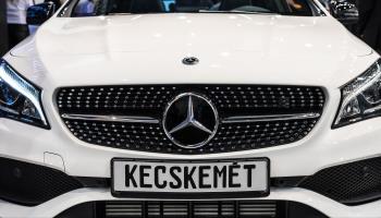 Mercedes exhibit one of its cars at a job fair in Hungary to advertise their factory in Kecskemet, Budapest, March 7, 2018 (Peter Csaszar/Shutterstock).
