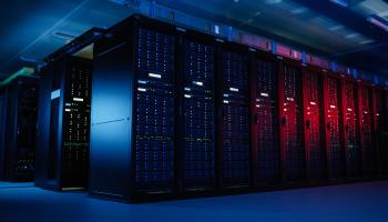 Data centre with multiple rows of server racks (Shutterstock)