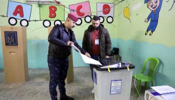 A member of the security services voting early in Iraq’s provincial elections, December 16, 2023. (Xinhua/Shutterstock)