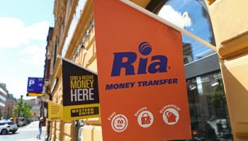 Western Union and Ria money transfer service flags (Jeppe Gustafsson/Shutterstock)
