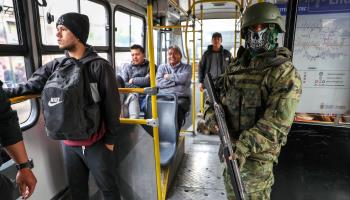 A soldier carrying out duties on a public bus in Quito. January 12, 2024 (JOSE JACOME/EPA-EFE/Shutterstock)