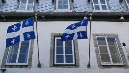 Quebec flags seen on a building in Quebec City, June 14, 2023 (Jakub Porzycki/NurPhoto/Shutterstock)