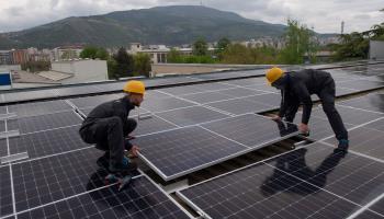 Solar panels being installed on the roof of a large supermarket, Skopje, April 19, 2023 (Georgi Licovski/EPA-EFE/Shutterstock)