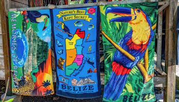 Colourful souvenir towels on display at a tourist shop in Belize (Shutterstock)