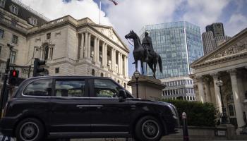 Taxi drives past the Bank of England, London (TOLGA AKMEN/EPA-EFE/Shutterstock)