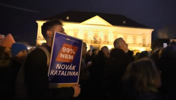 A protester holds a sign ''99% no to Katalin Novak'' at a demonstration against President Katalin Novak pardoning an accomplice in a child sexual abuse case, Budapest, February 9 (Balint Szentgallay/NurPhoto/Shutterstock).