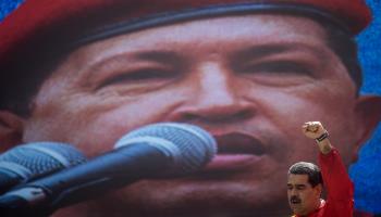 President Nicolas Maduro in front of a huge image of his predecessor Hugo Chavez (Miguel Gutierrez/EPA-EFE/Shutterstock)