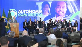 President Luiz Inacio Lula da Silva presenting a bill to regulate work for ride-hailing platforms (Ton Molina/NurPhoto/Shutterstock)