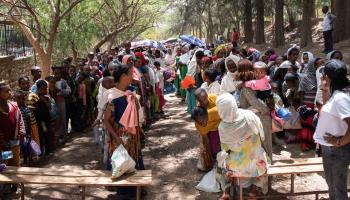 Women and children wait for a food distribution in Tigray, May 19, 2023. (Ximena Borrazas/SOPA Images/Shutterstock)