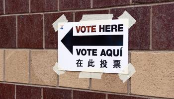 A multilingual sign directs voters to a polling station in New York City (Michael Brochstein/SOPA Images/Shutterstock)