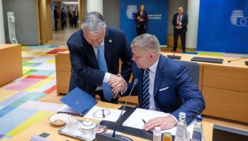 Hungarian Prime Minister Viktor Orban (L) and Slovak Prime Minister Robert Fico shake hands at the EU summit discussing the war in Ukraine and Gaza, Brussels, March 22  (Hollandse Hoogte/Shutterstock)