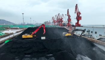Coal unloaded from a cargo vessel at the coal terminal in Lianyungang Port (Costfoto/NurPhoto/Shutterstock)