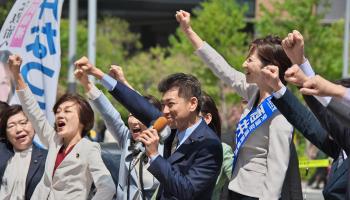 Constitutional Democratic Party of Japan leader Kenta Izumi and party candidate Natsumi Sakai at a by-election campaign rally (Shutterstock)
