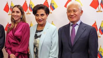 Ecuadoran Foreign Minister Gabriela Sommerfeld (C) poses with Chinese ambassador to Ecuador Chen Gouyou during an event to mark the trade agreement between their countries. Quito, May 1 2024 (Jose Jacome/EPA-EFE/Shutterstock)