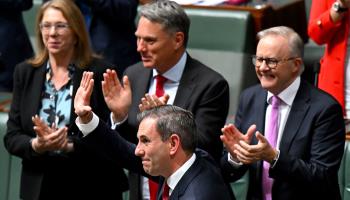 Treasurer Jim Chalmers is congratulated by Labor colleagues after delivering the budget to parliament in Canberra on May 14 (Lukas Coch/Shutterstock)