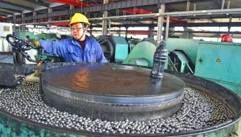 Workers in China making steel balls for export (Costfoto/NurPhoto/Shutterstock)