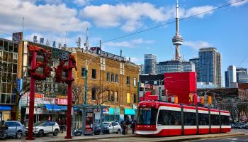 A streetcar travels through Toronto’s Chinatown, April 2023 (Creative Touch Imaging Ltd/NurPhoto/Shutterstock)