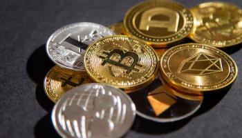 Illustrative examples of cryptocurrencies (Durand Thibaut/ABACA/Shutterstock)