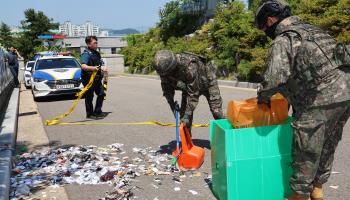 Military personnel in Incheon, west of Seoul, collect debris of balloons sent by North Korea (Yonhap/EPA-EFE/Shutterstock)