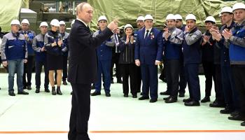 President Vladimir Putin speaks to workers at a defence factory (Kremlin Pool/UPI/Shutterstock)