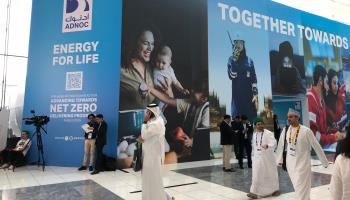ADNOC exhibitor stand promoting its green energy aims, October 2, 2023 (Shutterstock)