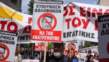 Protesters carrying anti-government placards in Athens during a nationwide strike over rising living costs, 17 April 2024 (Dimitris Aspiotis/Shutterstock)