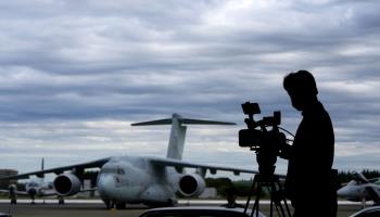 A media worker films an air review ceremony at the Air Self-Defence Force’s Iruma Air Base in Sayama (Franck Robichon/EPA-EFE/Shutterstock)

