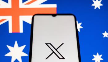 Photo illustration shows the X logo and an Australian flag (Nikolas Kokovlis/NurPhoto/Shutterstock)